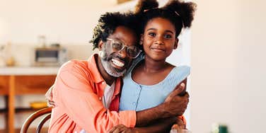 Dad hugging daughter which is no big deal 