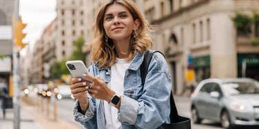 woman looking up from phone on do not disturb
