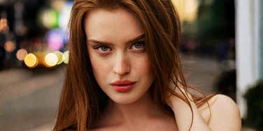 Woman looking fiercely into the camera, illustrating traits of a ‘complicated’ woman that make her unforgettable