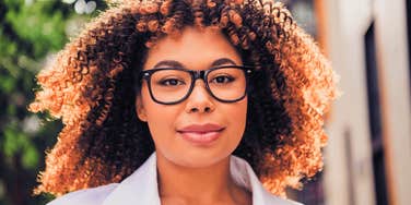 smiling woman who is more intelligent than she knows