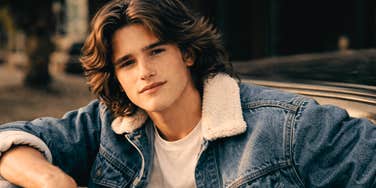 The iconic 1980s teen heartthrob, featuring acid wash denim and perfectly feathered hair, embodying the effortless cool that inspired a generation.