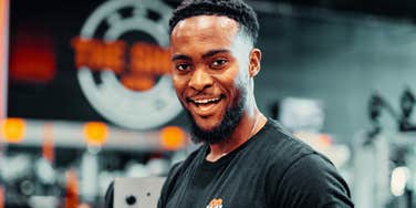 A portrait of a fit man in his fifties at a fitness center, representing 'epigenetic reprogramming' and the three daily habits that slow cellular aging.