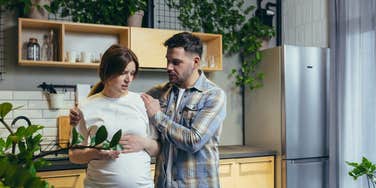 husband arguing with his pregnant wife about money