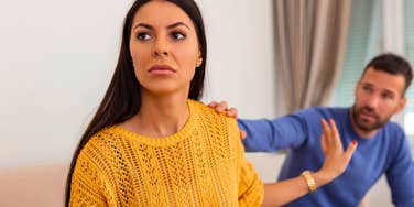 emotional woman snapping at partner and isolating herself at home