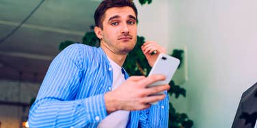 lazy man using chatgpt on his phone and computer