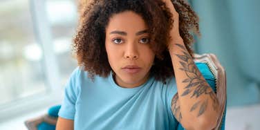 woman who grew up surrounded by fake friends feeling stressed