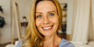 introverted woman in her sixties feeling happy about life