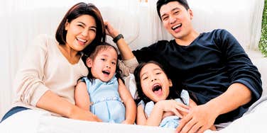 parents allowing their kids to lay in bed with them