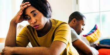 lonely woman tolerating distance from her partner at home