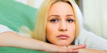 sad woman thinking about the people in her life not liking her