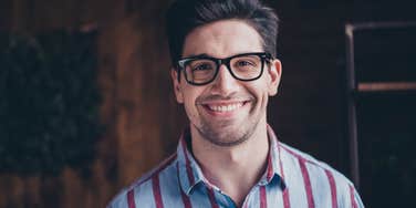 Attractive man in glasses who has characteristics that give him an advantage with women