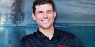 A portrait of the author, illustrating the 'acquired disability' experience and the psychological resilience required to navigate a life-changing spinal cord injury.