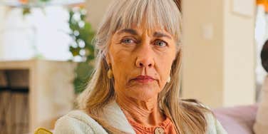 highly intelligent woman feeling annoyed by her surroundings