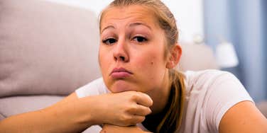 annoyed woman painfully bored with her life