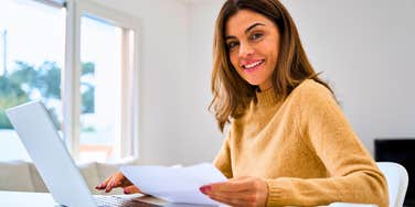 woman being smart with her money paying bills on time