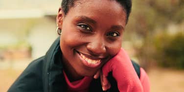 happy woman with a truly brilliant mind smiling