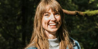 A portrait of a woman radiating joy and kindness; illustrating the rare behavioral traits that make certain people a 'joy to be around' in social settings