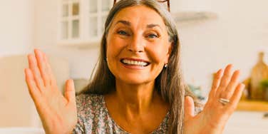 calm and relaxed older woman smiling confidently