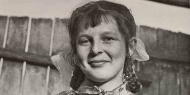 A candid 1960s image of a girl in a rural village; a visual representation of the 'rare traits' research suggests were common in 60s and 70s childhoods but are missing in modern kids.