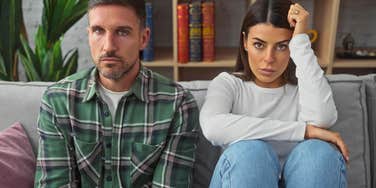 serious and distant couple heading into a silent divorce