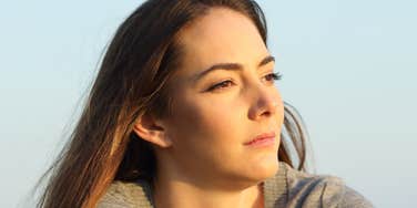 Woman is only half-in her relationship.