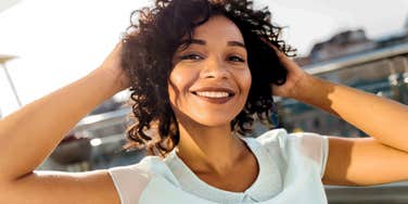 smiling woman relaxing feeling happy with her life