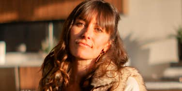 A woman looking contemplative outdoors while experiencing sadness, illustrating the simple mental habits that build exceptional inner strength over time.