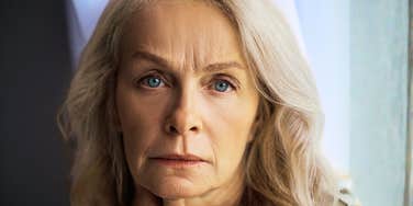 A portrait of a woman in her sixties with a subtle look of fatigue, representing the 'masked depression' and physiological changes common in later life.