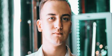 A portrait of a man with a steady, unblinking gaze; a visual representation of the 'flat affect' or lack of warmth that psychologists identify as a subtle red flag in conversation.
