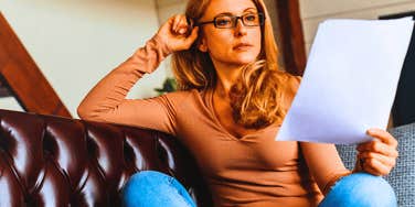 Gen X mom looking at her financial records