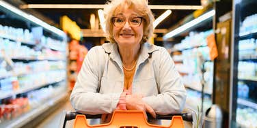 lower income woman shopping at grocery store