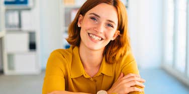 confident woman with self-worth and common sense smiling big