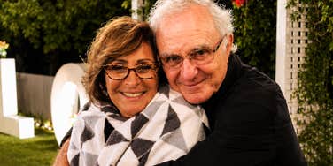 A candid moment of the author embracing a loved one; illustrating the human side of navigating an early Alzheimer’s diagnosis that was initially mistaken for typical aging.