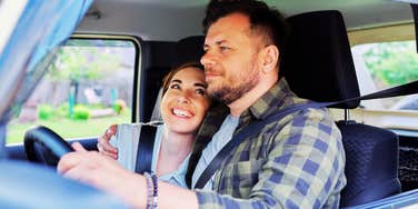 A portrait of a husband and wife sharing a quiet moment of connection during travel.
