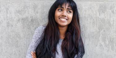 A woman who is a true empath smiles warmly 