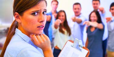 woman experiencing a common humiliation ritual at her job