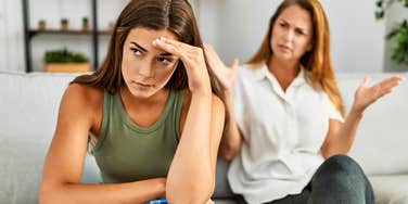 adult daughter ignoring mother with painful traits