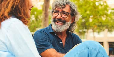 man having a casual conversation with woman seeing how deep she is