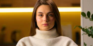 serious and manipulative woman staring blankly