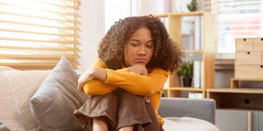 'cinderella' daughter upset sitting on bed