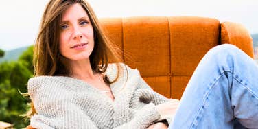 woman with exceptional self-control relaxing on a couch
