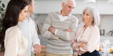 man talking to older parents