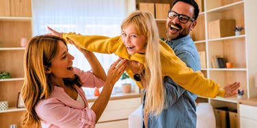 parents making great childhood memories with their kid playing
