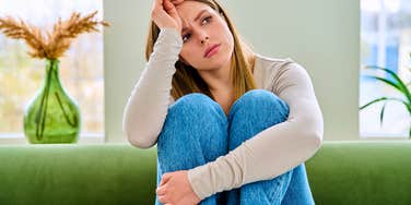 woman feeling stressed thinking about difficult childhood