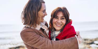 Woman who did an exceptional job raising her adult daughter who is hugging her