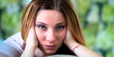 stressed woman whose body is telling her something is wrong
