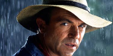 A close-up of Sam Neill as Dr. Alan Grant in a field during Jurassic Park; illustrating the 'time-warp' feeling Millennials experience when realizing they are older than the characters who defined adulthood for them in the 1990s.