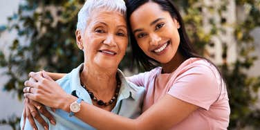 mother and daughter with a very close relationship hugging