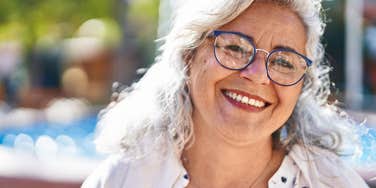 middle aged woman smiling laughing at younger generations