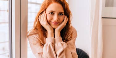 woman with a very high iq looking interested in asking questions during conversation